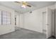 Bedroom featuring mirrored closet doors and neutral carpet at 2344 Valleywood St, Henderson, NV 89014