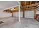 Spacious three-car garage with exposed ceiling and concrete flooring at 2344 Valleywood St, Henderson, NV 89014