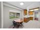 Eat-in kitchen with wood cabinets and a window view of the backyard at 2344 Valleywood St, Henderson, NV 89014