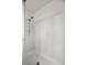 Walk-in shower with white tiles and shower head at 2344 Valleywood St, Henderson, NV 89014