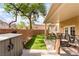 View of backyard with a covered patio, brick fencing, an exterior shed and outdoor seating at 2354 Buffalo Run Ave, Las Vegas, NV 89123