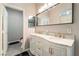 Elegant bathroom featuring double vanity, marble countertop, and modern fixtures at 2354 Buffalo Run Ave, Las Vegas, NV 89123