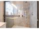 Walk-in shower with gray tile, glass door, and built-in niche at 2354 Buffalo Run Ave, Las Vegas, NV 89123