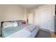 Cozy bedroom with plush pillows on bed, door, and light walls, perfect for relaxing at 2354 Buffalo Run Ave, Las Vegas, NV 89123