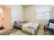 Bright bedroom with wood floors, window, and doorway to bathroom at 2354 Buffalo Run Ave, Las Vegas, NV 89123