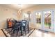 Cozy dining area with a stylish table set, backyard views, and ample natural light at 2354 Buffalo Run Ave, Las Vegas, NV 89123