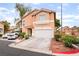Inviting two-story home with a two-car garage, ample parking, and neat landscaping at 2354 Buffalo Run Ave, Las Vegas, NV 89123