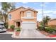 Charming two-story home with a two-car garage, tidy landscaping and a welcoming entrance at 2354 Buffalo Run Ave, Las Vegas, NV 89123
