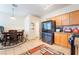 Well-lit kitchen with modern appliances, tile flooring, and a dining area with backyard access at 2354 Buffalo Run Ave, Las Vegas, NV 89123