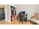 Home office with laminate flooring, computer desk, black office chair, and closet at 2354 Buffalo Run Ave, Las Vegas, NV 89123
