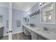 Bathroom featuring double sinks, white marble countertops, and a glass-enclosed shower at 2860 Misty Ct, Henderson, NV 89074