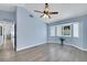 Spacious bedroom with a vaulted ceiling, two windows, and light blue walls at 2860 Misty Ct, Henderson, NV 89074