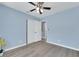Comfortable bedroom with sleek flooring, ceiling fan, closet, and art at 2860 Misty Ct, Henderson, NV 89074