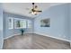 Bedroom features a vaulted ceiling, with light blue walls, and a bay window at 2860 Misty Ct, Henderson, NV 89074