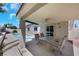Covered patio with outdoor furniture overlooking a backyard pool at 2860 Misty Ct, Henderson, NV 89074