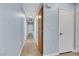 Clean hallway with wooden floors, neutral walls, and recessed lighting at 2860 Misty Ct, Henderson, NV 89074
