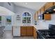 Bright kitchen featuring an arched window over the sink and modern appliances at 2860 Misty Ct, Henderson, NV 89074