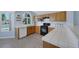 Kitchen showcasing modern appliances, ample cabinetry, and tile countertops at 2860 Misty Ct, Henderson, NV 89074