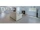 Living room showing fireplace, vaulted ceilings, and open layout into the kitchen at 2860 Misty Ct, Henderson, NV 89074