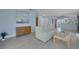 Open-concept living room with neutral tones and bright interior with access to kitchen at 2860 Misty Ct, Henderson, NV 89074