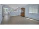 Open-concept living area with neutral paint, wood-look flooring, and plenty of natural light at 2860 Misty Ct, Henderson, NV 89074
