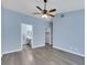 Spacious primary bedroom featuring light blue walls and an ensuite bathroom and closet at 2860 Misty Ct, Henderson, NV 89074