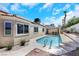 Backyard pool view with desert landscaping and seating area at 2860 Misty Ct, Henderson, NV 89074