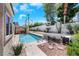 Backyard view showcasing the pool, rock landscaping, and desert plants at 2860 Misty Ct, Henderson, NV 89074
