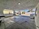 A covered back patio with concrete flooring and sturdy support columns at 3215 Dillon Ave, North Las Vegas, NV 89030