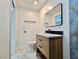 Bathroom with modern vanity, toilet, and a mirror, complimented by stylish fixtures at 3215 Dillon Ave, North Las Vegas, NV 89030