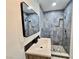 Bathroom features updated vanity, modern fixtures, and a walk-in shower with stunning blue marble-look tiles at 3215 Dillon Ave, North Las Vegas, NV 89030