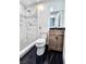 Updated bathroom with a marble-tiled shower and modern vanity at 3215 Dillon Ave, North Las Vegas, NV 89030