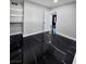 Bedroom featuring black marble flooring, closet shelving, and hallway access at 3215 Dillon Ave, North Las Vegas, NV 89030