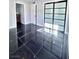 Bedroom boasting black marble flooring, access to the bathroom and sliding door closet at 3215 Dillon Ave, North Las Vegas, NV 89030