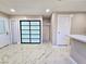 Spacious room with marble floors and a closet with a sliding door offers ample storage at 3215 Dillon Ave, North Las Vegas, NV 89030