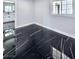 Bedroom showcasing elegant black marble floors, ample natural light, and neutral paint at 3215 Dillon Ave, North Las Vegas, NV 89030