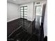 Bedroom showcasing black marble floors, natural light and sliding door closet at 3215 Dillon Ave, North Las Vegas, NV 89030