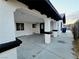 Wide carport featuring white columns with black trim, providing ample covered parking and curb appeal at 3215 Dillon Ave, North Las Vegas, NV 89030