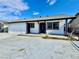 Charming white stucco home with black trim and concrete driveway at 3215 Dillon Ave, North Las Vegas, NV 89030