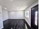 Bright living room showcasing recessed lighting and sleek black marble floors at 3215 Dillon Ave, North Las Vegas, NV 89030