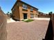 Backyard with a low-maintenance desert landscape and a small patch of artificial turf at 3221 Villa Pisani Ct, North Las Vegas, NV 89031