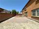 Spacious backyard with desert landscaping and ample space for outdoor activities at 3221 Villa Pisani Ct, North Las Vegas, NV 89031