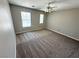 Bedroom featuring neutral colors, plush carpet, and natural light from two windows at 3221 Villa Pisani Ct, North Las Vegas, NV 89031