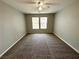 Neutral bedroom with carpet and two windows, ideal for peaceful retreats and relaxation at 3221 Villa Pisani Ct, North Las Vegas, NV 89031