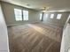 Expansive bonus room with lots of natural light, offering versatile space for entertainment or relaxation at 3221 Villa Pisani Ct, North Las Vegas, NV 89031