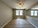 Bonus room featuring laminate floors, a ceiling fan, and windows that provide ample natural light at 3221 Villa Pisani Ct, North Las Vegas, NV 89031