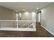 Hallway featuring neutral color palette, plush carpet, and white railing at 3221 Villa Pisani Ct, North Las Vegas, NV 89031