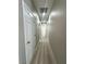 Hallway featuring wood-look floors and access to various rooms and a bathroom at 3221 Villa Pisani Ct, North Las Vegas, NV 89031