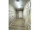 Spacious laundry room with overhead lighting, laminate flooring, and wire shelving for ample storage at 3221 Villa Pisani Ct, North Las Vegas, NV 89031