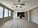 Open living space with modern flooring and abundant natural light, seamlessly flowing into the kitchen area at 3221 Villa Pisani Ct, North Las Vegas, NV 89031